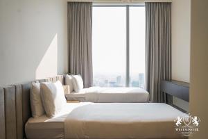 Ένα ή περισσότερα κρεβάτια σε δωμάτιο στο Westminster Forte Burj Khalifa