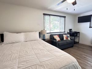 a bedroom with a large bed and a couch at Alhonna Resort in Lake Ozark +197 photos