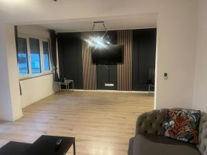 a person taking a picture of a living room at Big Apartment in Bochum in Bochum