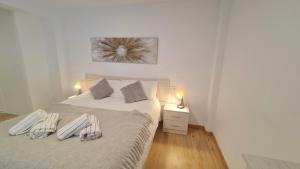 Posteľ alebo postele v izbe v ubytovaní Duplex Huelin I & Beach