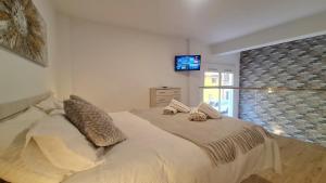 Posteľ alebo postele v izbe v ubytovaní Duplex Huelin I & Beach