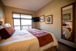 a hotel room with two beds and a large window at Ski IN Out, Perfect Location King Bed at Sundial Lodge w Hot Tub and Pool! in Park City +27 photos