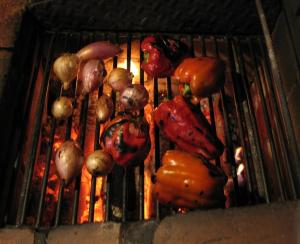 a bunch of vegetables cooking on a grill at Casa Dos Canais, River Cottage in Marco de Canavezes