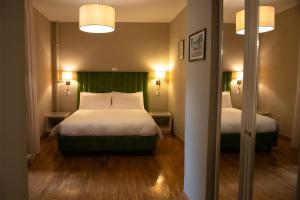 Postel nebo postele na pokoji v ubytování Hotel Suisse