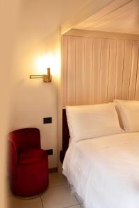 Postel nebo postele na pokoji v ubytování Hotel Suisse