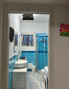 a bathroom with a sink and a toilet and a shower at la Casa del Mare in Badesi