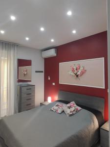 Postel nebo postele na pokoji v ubytování Casa Orchidea Mazzeo