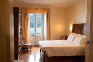 Postel nebo postele na pokoji v ubytování Hotel Suisse