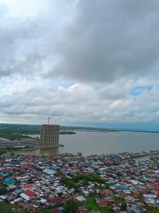 an aerial view of a city next to a body of water at Seaview Emerald Sandakan in Sandakan