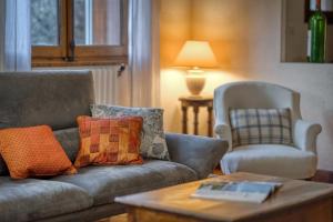 a living room with a couch and a chair at #HP La maison des Lilas Large family house sleeps 12 garden in Seyssins