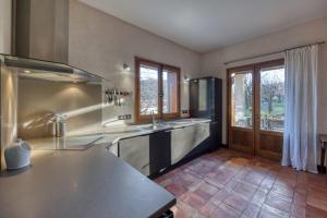 a kitchen with a sink and a counter top at #HP La maison des Lilas Large family house sleeps 12 garden in Seyssins +36 photos