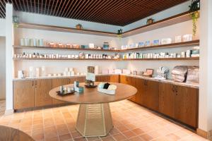a room with a table and shelves in a store at Murrieta Hot Springs Resort in Murrieta