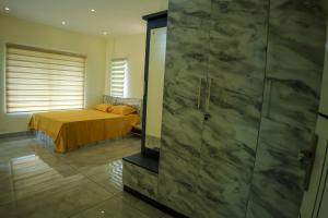 Ein Bett oder Betten in einem Zimmer der Unterkunft Vcode HillView