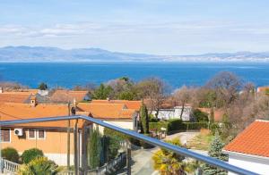 a view of the ocean from the balcony of a house at Luxury apartments Vanessa, Njivice in Njivice