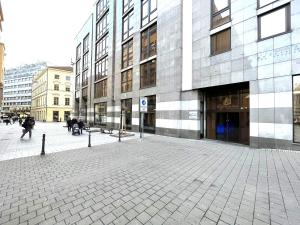 an empty street in a city with a building at Matis 3 - Apartmán Brno centrum in Brno