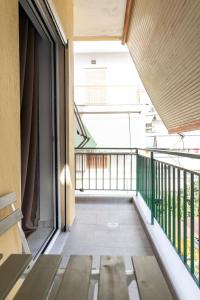 an empty balcony with benches on a building at Secret Diamond Trikala in Tríkala +61 photos