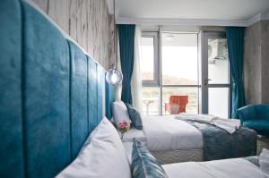 Postel nebo postele na pokoji v ubytování Hill Life Hotel