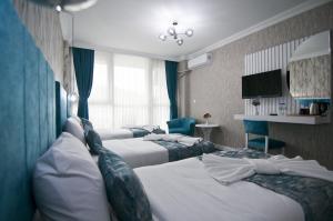 Postel nebo postele na pokoji v ubytování Hill Life Hotel