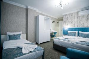Postel nebo postele na pokoji v ubytování Hill Life Hotel