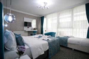 Postel nebo postele na pokoji v ubytování Hill Life Hotel