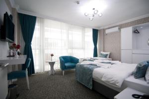 Postel nebo postele na pokoji v ubytování Hill Life Hotel