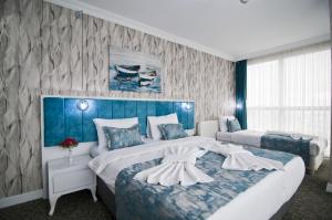 Postel nebo postele na pokoji v ubytování Hill Life Hotel