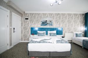 Postel nebo postele na pokoji v ubytování Hill Life Hotel