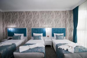 Postel nebo postele na pokoji v ubytování Hill Life Hotel