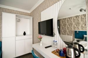 TV a/nebo společenská místnost v ubytování Hill Life Hotel
