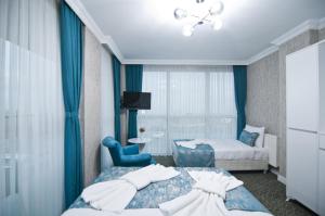 Postel nebo postele na pokoji v ubytování Hill Life Hotel
