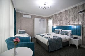 Postel nebo postele na pokoji v ubytování Hill Life Hotel