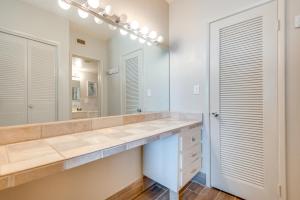 a bathroom with a large sink and a mirror at Direct Beach Access and View Satellite Beach Condo! in Satellite Beach +30 photos