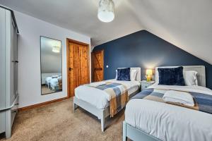 Postel nebo postele na pokoji v ubytování Season cottages by Escape Ordinary