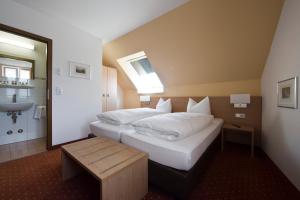 Postel nebo postele na pokoji v ubytování Taste Style Hotel Bären Auggen