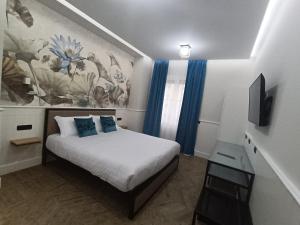 Postel nebo postele na pokoji v ubytování Le terme alloggio turistico + 9 fotografií