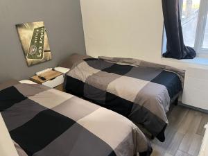 Posteľ alebo postele v izbe v ubytovaní Appartement t2