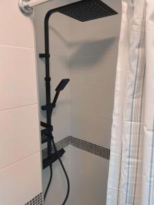 a mirror in a bathroom with a shower at A piece of paradise in Puerto de la Cruz in Puerto de la Cruz