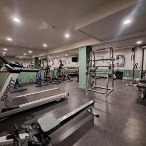 a gym with several treadmills and machines in it at Riverbend Townhomes by StayIn in Panorama