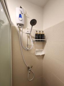 a shower in a bathroom with a shower at K Residence at 1910 - Fully styled studio with sea view in Bacolod