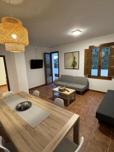 a living room with a table and a couch at Paraiso Natural Unico -Villa Cueva Turche in Valencia