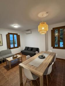 a living room with a table and a couch at Paraiso Natural Unico -Villa Cueva Turche in Valencia