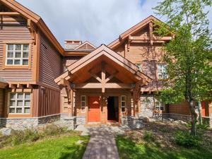 a house with a cross on the front of it at Riverbend Townhomes by StayIn in Panorama