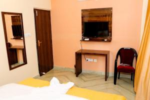 Postel nebo postele na pokoji v ubytování Sunflower Inn