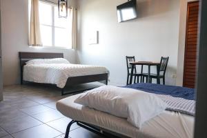 Postel nebo postele na pokoji v ubytování Las Alturas Loft 302