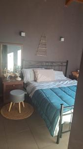 Postel nebo postele na pokoji v ubytování Ex fienile nella natura - Camera con bagno privato e spazi comuni + 11 fotografií