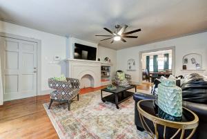 a living room with a couch and a fireplace at Lincoln Lodge A near OU Med Bricktown Arena in Oklahoma City