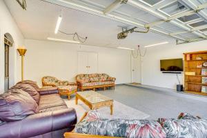 a living room with couches and a tv at Large Yard, Fire Pit and Games Grandview Haven! in Alvarado