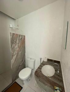 a bathroom with a toilet and a sink at Suíte 203 - Pousada no Centro do Rio in Rio de Janeiro