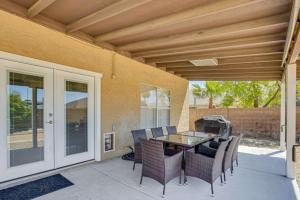 a patio with a table and chairs and a grill at Valley View Retreat in Glendale