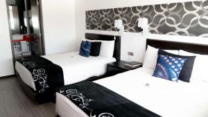 Postel nebo postele na pokoji v ubytování Hotel Black Boutique